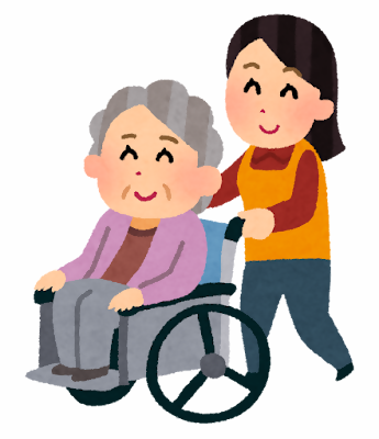 車いすに乗った高齢者を介助する様子