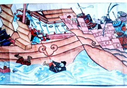 武士が船の上で争っている様子を描いた紙本着色綾木八幡縁起絵巻の写真